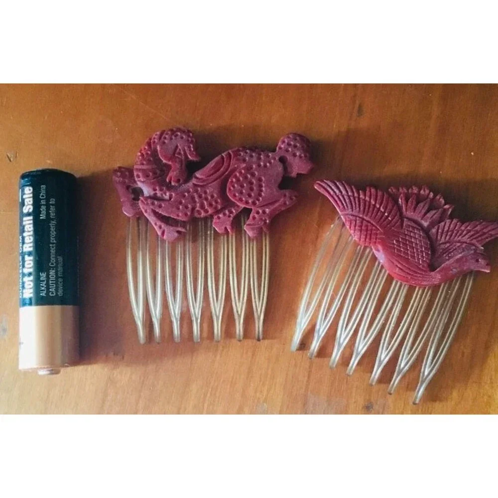 Vintage plastic, possibly Bakelite Asian horse and bird hair combs